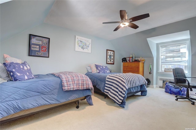 bedroom with radiator heating unit, carpet floors, ceiling fan, and lofted ceiling