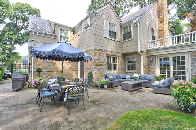 view of patio / terrace featuring outdoor lounge area, a balcony, and grilling area