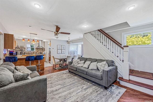 living room with hardwood / wood-style flooring and ceiling fan