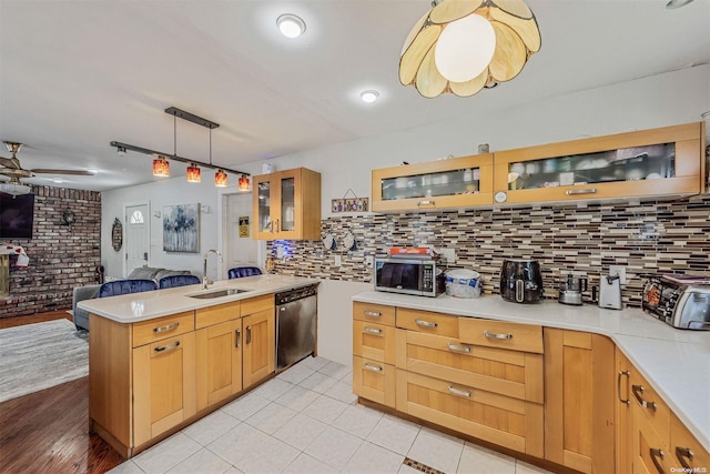 kitchen with pendant lighting, dishwasher, sink, light hardwood / wood-style flooring, and ceiling fan