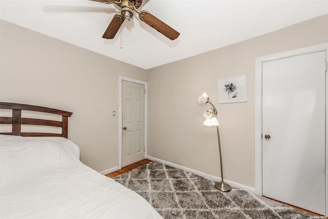 unfurnished bedroom with ceiling fan and wood-type flooring