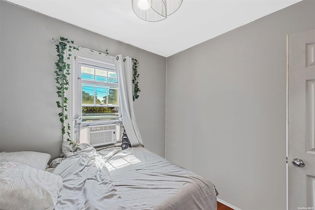 bedroom with hardwood / wood-style floors