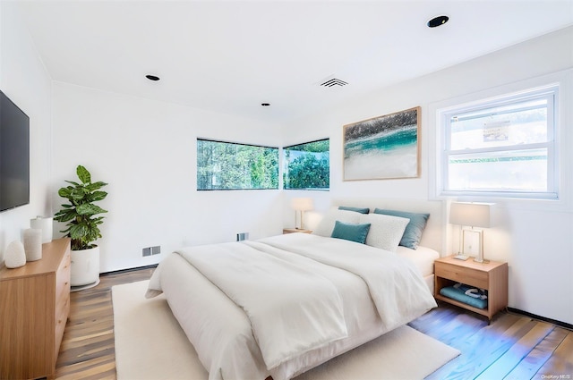 bedroom with wood-type flooring