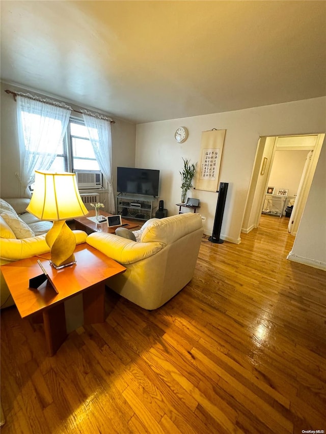 living room featuring cooling unit and light wood-type flooring