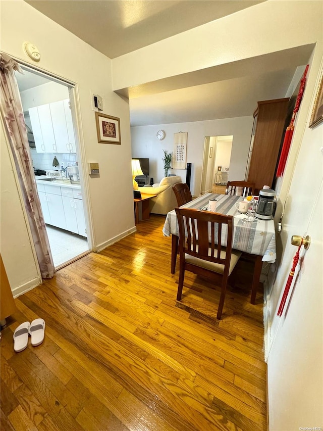 dining area with light wood-type flooring