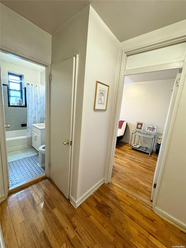 hall with light wood-type flooring