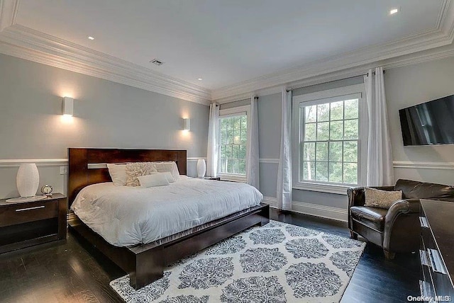 bedroom with dark hardwood / wood-style floors and ornamental molding