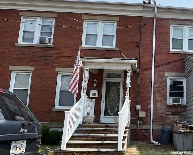 view of front of property with cooling unit