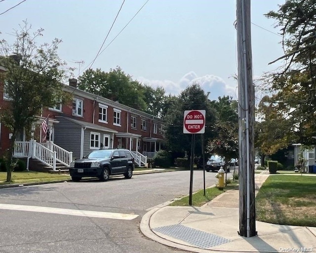 5 Columbia St, Farmingdale, NY 11735 - view of asphalt street featuring curbs, traffic signs, and sidewalks