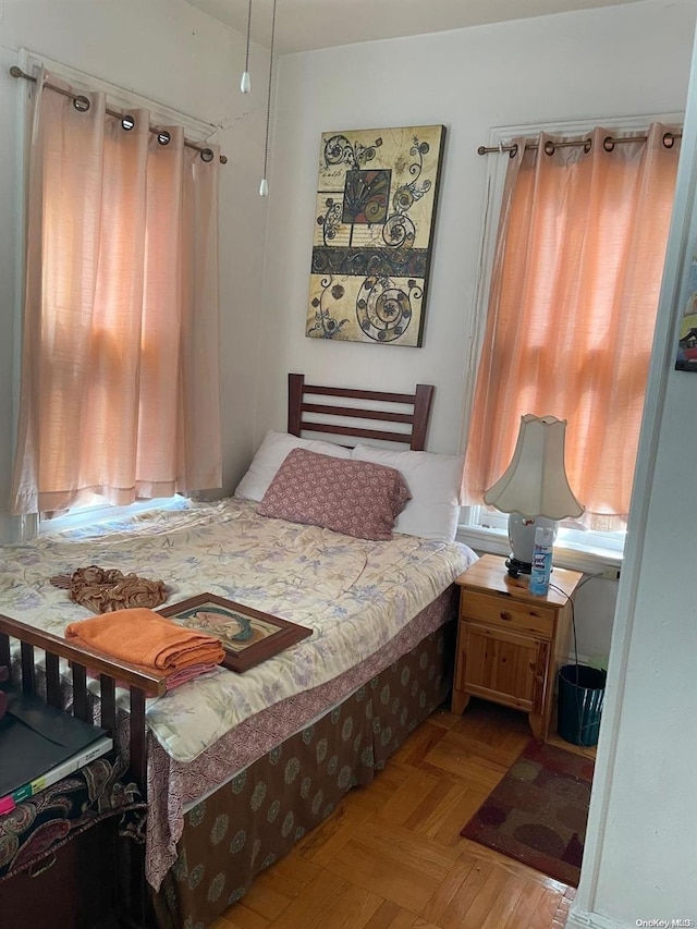 bedroom featuring light parquet floors