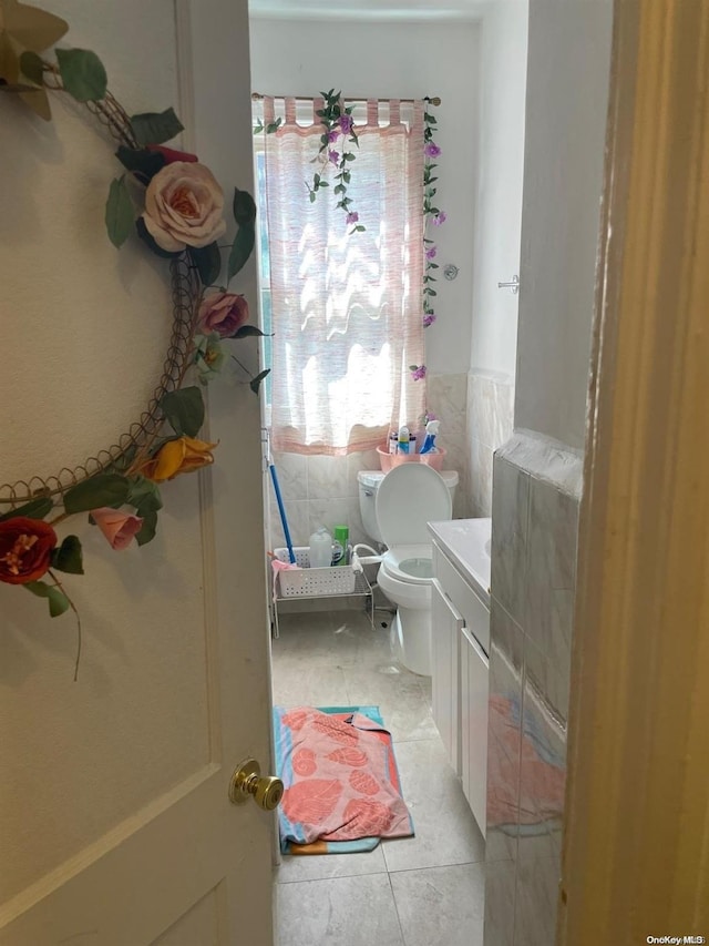 bathroom with tile patterned floors, vanity, and toilet