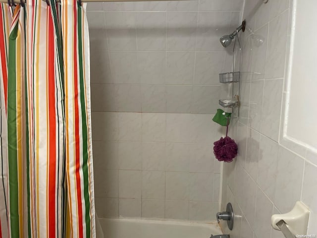 bathroom with shower / bathtub combination with curtain