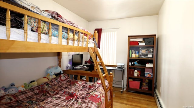 bedroom with hardwood / wood-style floors