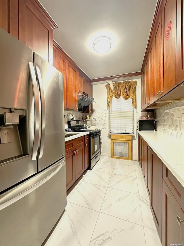 kitchen featuring sink, backsplash, and appliances with stainless steel finishes