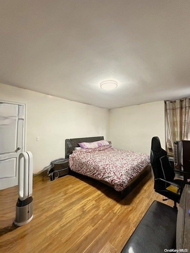 bedroom featuring hardwood / wood-style flooring