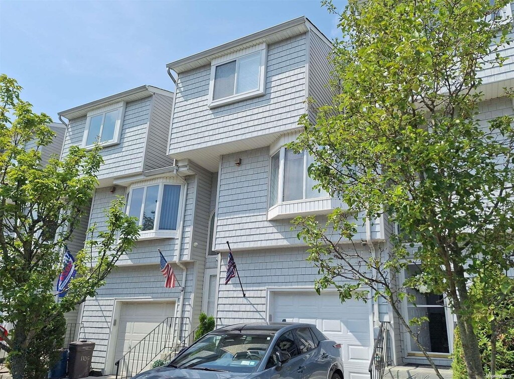110F Dinsmore St Unit 110F, Staten Island, NY 10314 - townhome / multi-family property featuring a garage