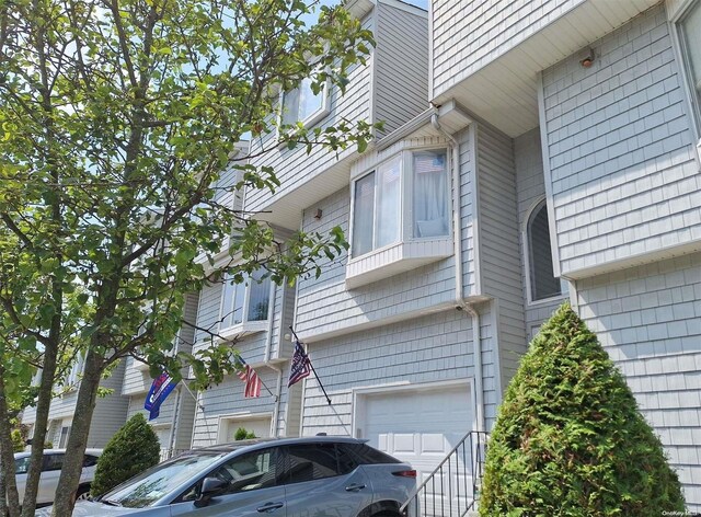 110F Dinsmore St Unit 110F, Staten Island, NY 10314 - view of side of home with a garage