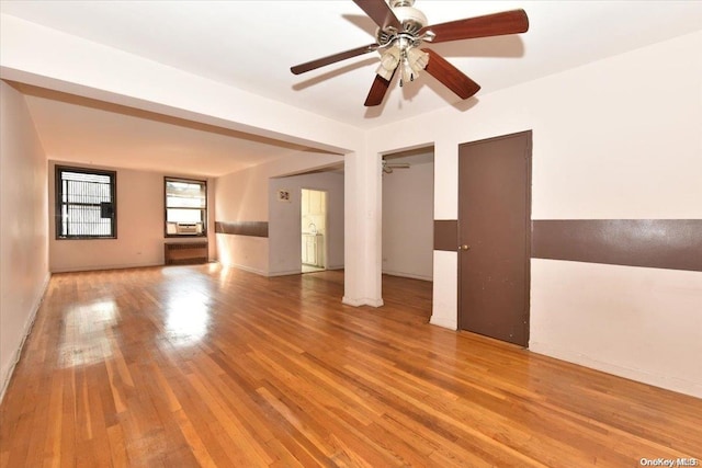 spare room with ceiling fan and light hardwood / wood-style flooring