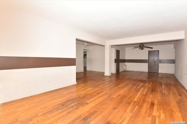 unfurnished living room featuring wood-type flooring