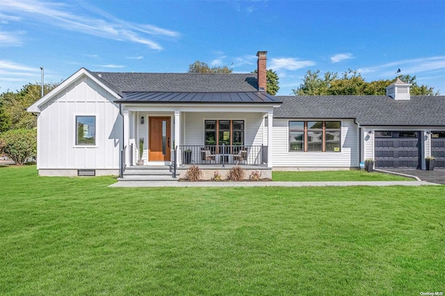 view of front of house with a front yard and a porch