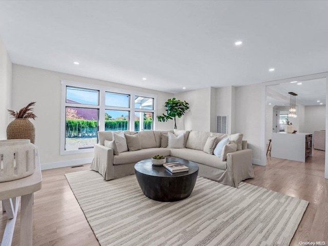 living room with light hardwood / wood-style flooring