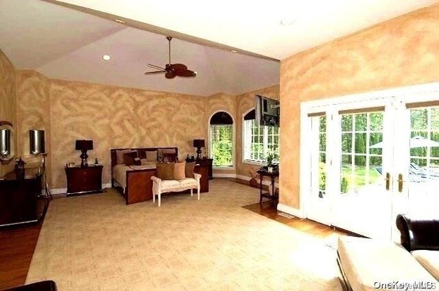 bedroom with access to exterior and lofted ceiling