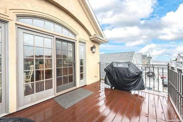 wooden terrace with area for grilling