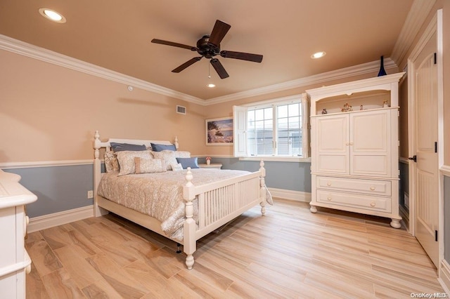 bedroom with light hardwood / wood-style flooring, ceiling fan, and ornamental molding