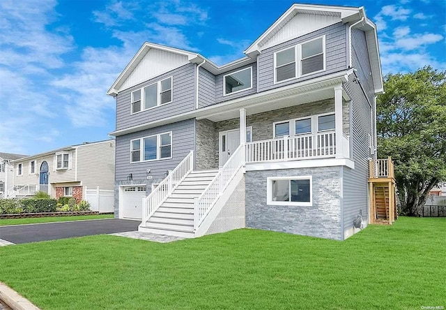 view of front facade featuring a garage and a front yard