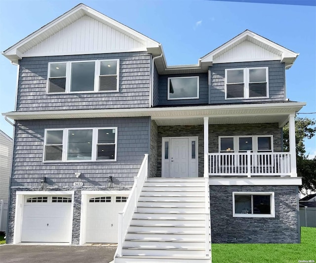 view of front facade with a porch and a garage