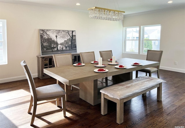 dining space featuring ornamental molding, an inviting chandelier, and dark wood-type flooring