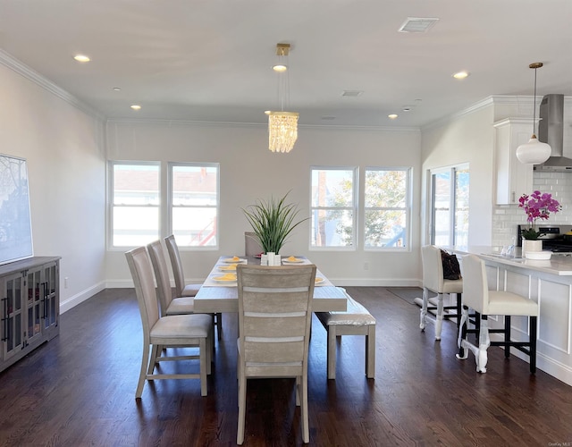 dining area featuring crown molding and a wealth of natural light