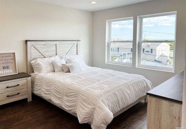 bedroom featuring dark wood-type flooring