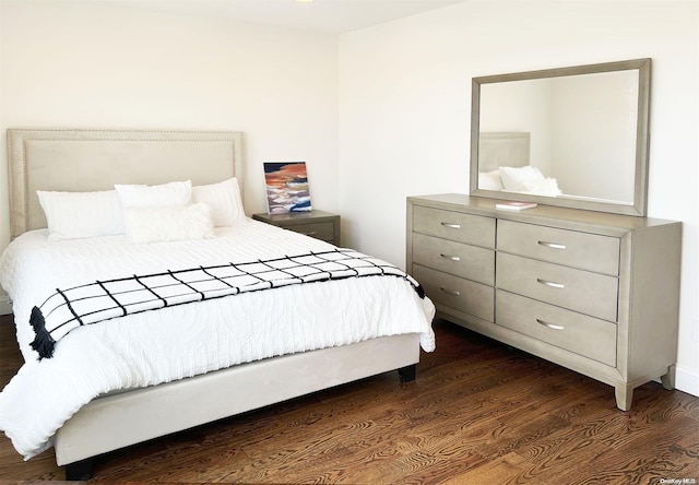 bedroom featuring dark hardwood / wood-style floors