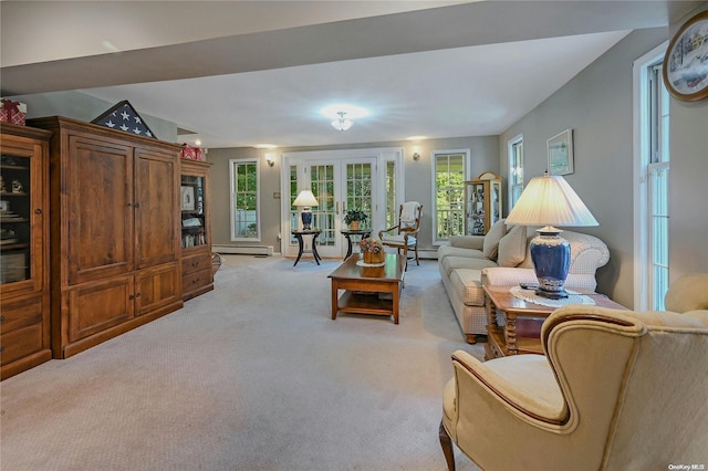 carpeted living room with french doors and a baseboard radiator