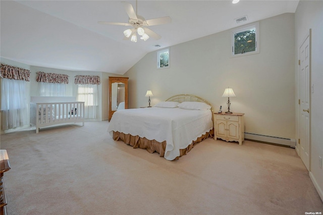 bedroom with light carpet, lofted ceiling, ceiling fan, and a baseboard heating unit