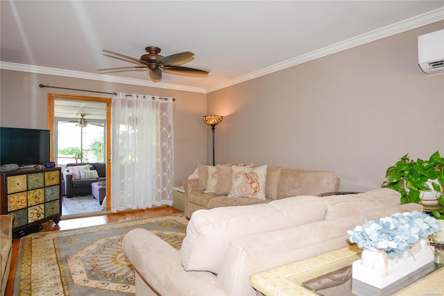 living room with an AC wall unit, ceiling fan, hardwood / wood-style floors, and ornamental molding