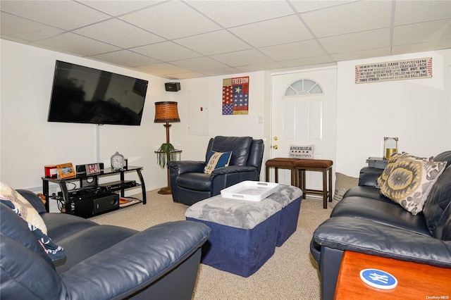 living room with carpet floors and a drop ceiling