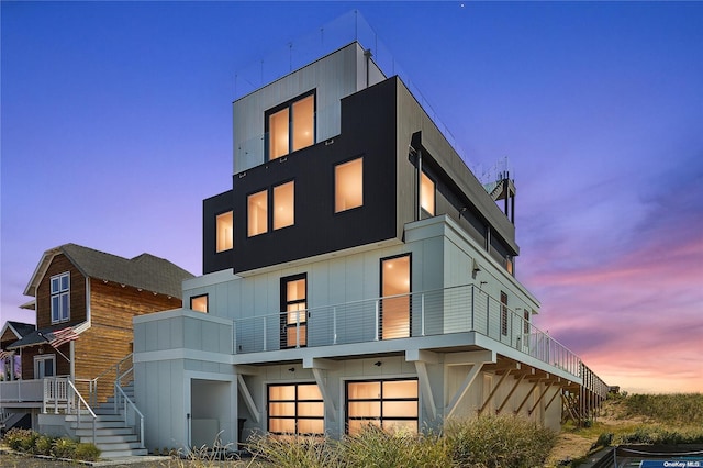 back house at dusk with a garage