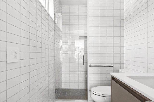 773 Dune Rd, Westhampton Beach, NY 11978 - full bathroom featuring tile walls, a stall shower, and vanity