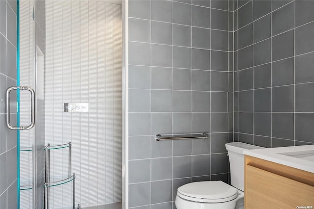 773 Dune Rd, Westhampton Beach, NY 11978 - full bath with tile walls, vanity, and a shower with shower door