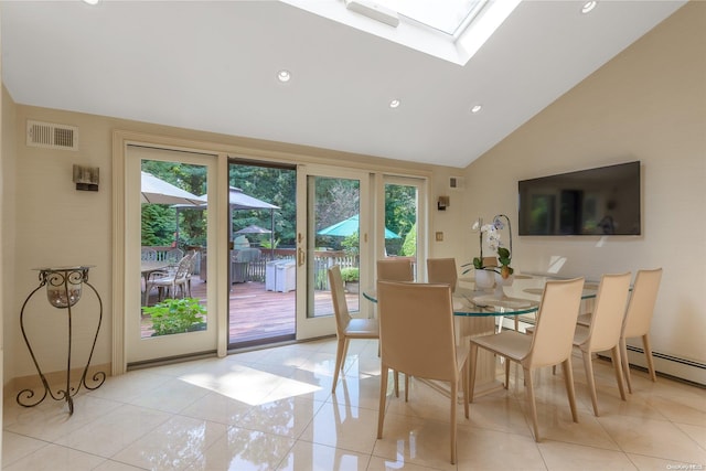 dining room featuring light tile patterned floors, high vaulted ceiling, and a skylight