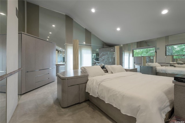 carpeted bedroom with high vaulted ceiling