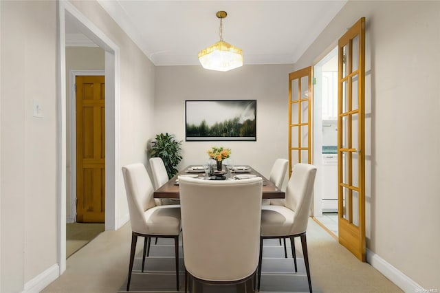 dining area with carpet and french doors