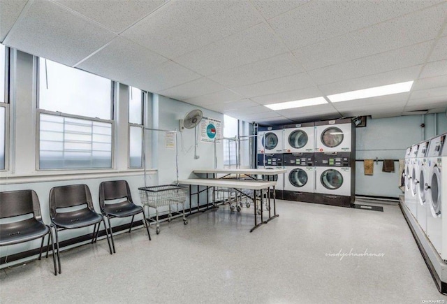 laundry room with stacked washer and clothes dryer