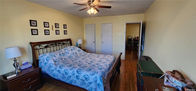 bedroom with ceiling fan and dark hardwood / wood-style flooring