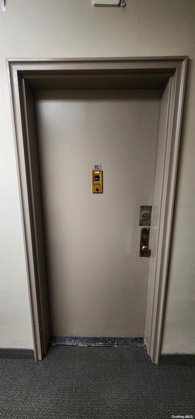 175-45 88th Ave Unit 7C, Jamaica, NY 11432 - laundry area with carpet flooring