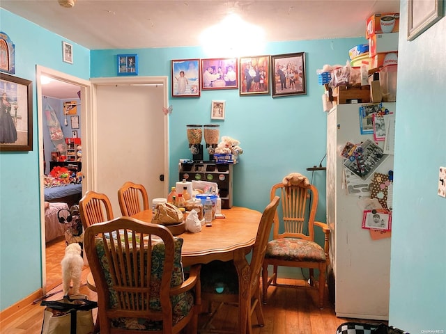 dining room with hardwood / wood-style floors