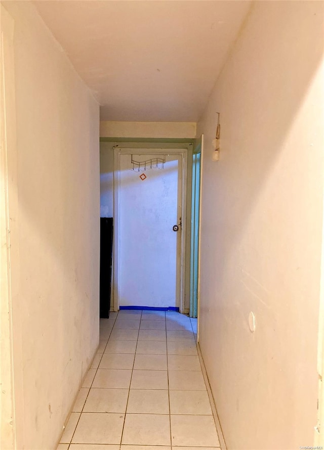 hallway featuring light tile patterned floors