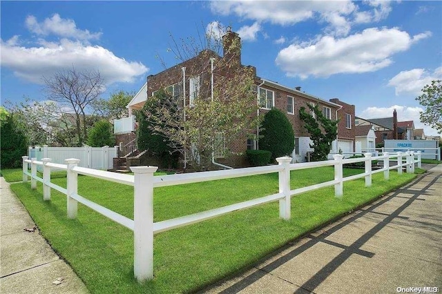 view of home's exterior with a yard and a garage